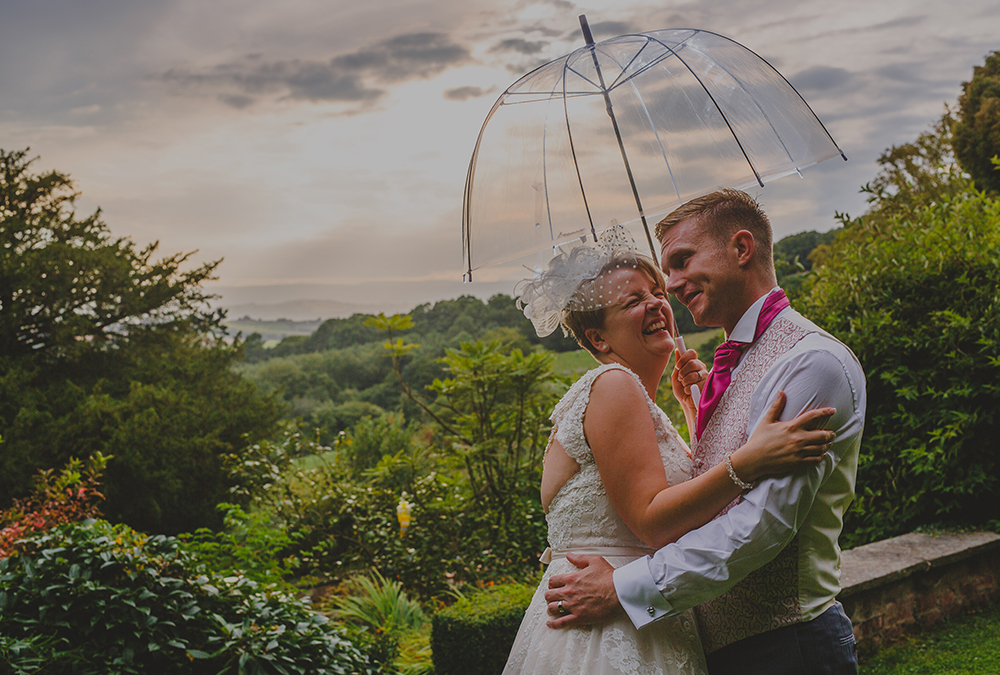 Wedding Couple under umbrella